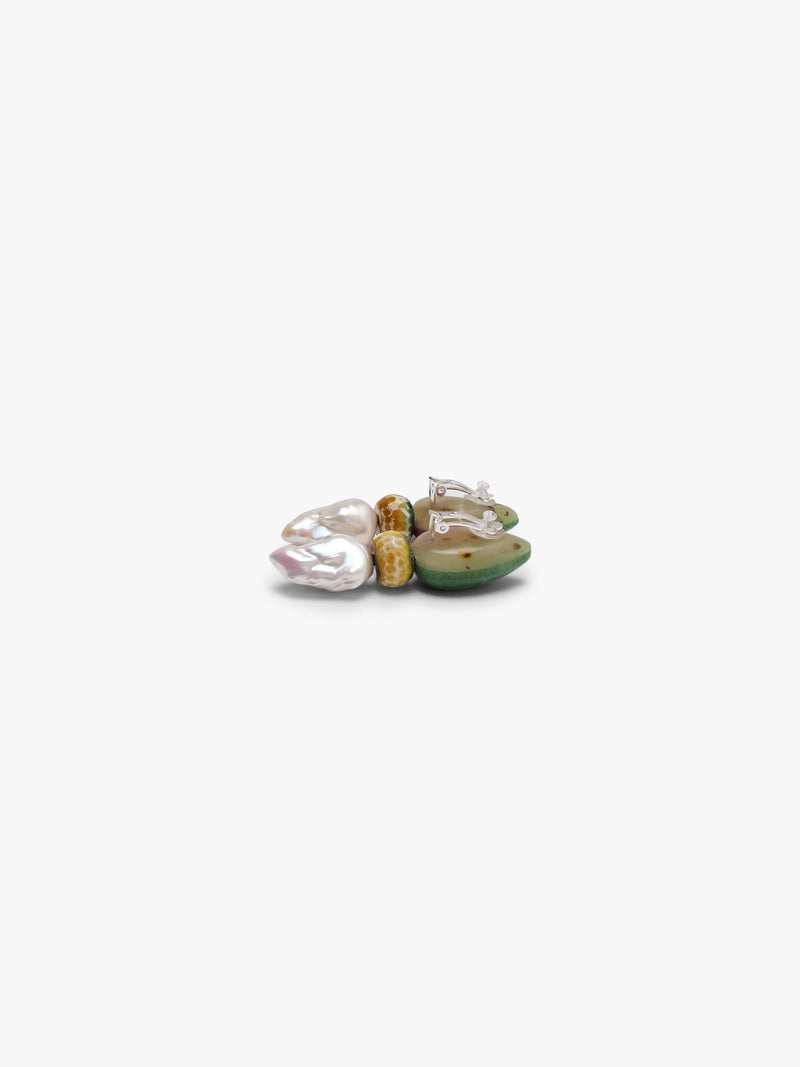 Earrings with a green and purple top paired with a small yellow stone and baroque pearls. Displayed on a white background. 