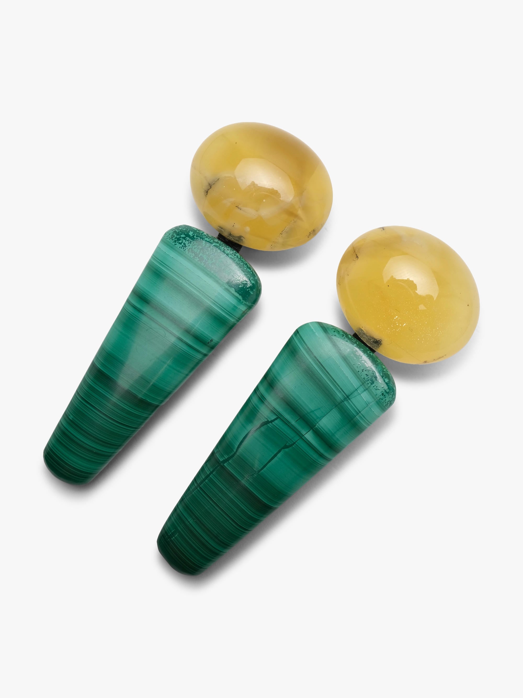 Long, chunky turquoise and yellow drop earrings against a solid white background
