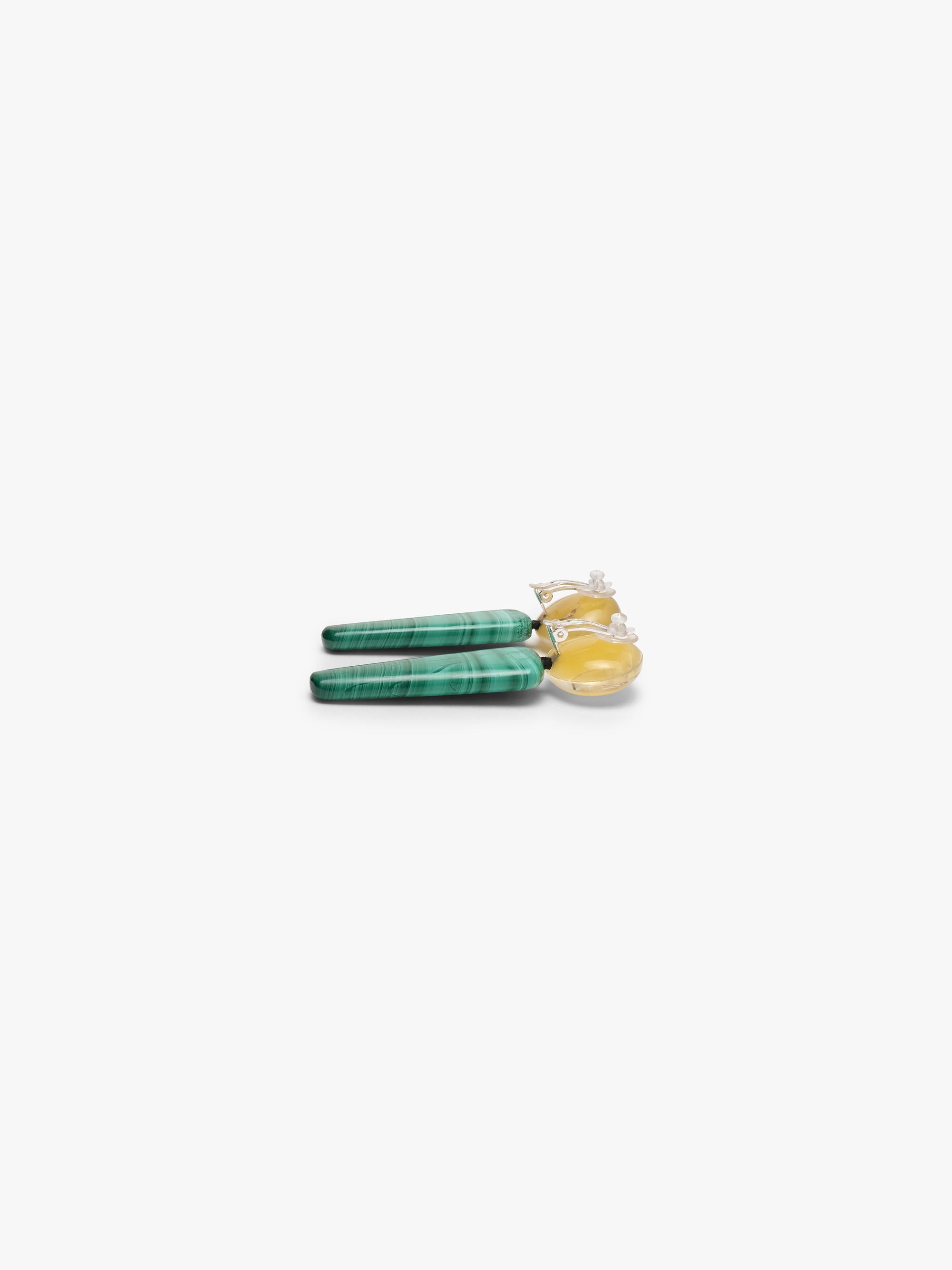Long, chunky turquoise and yellow drop earrings against a solid white background