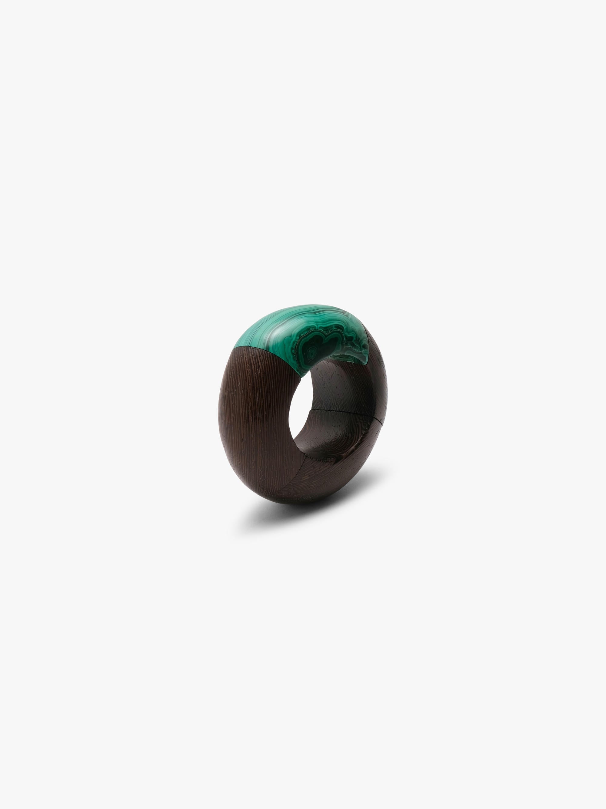 Brown and green bracelet on a white background