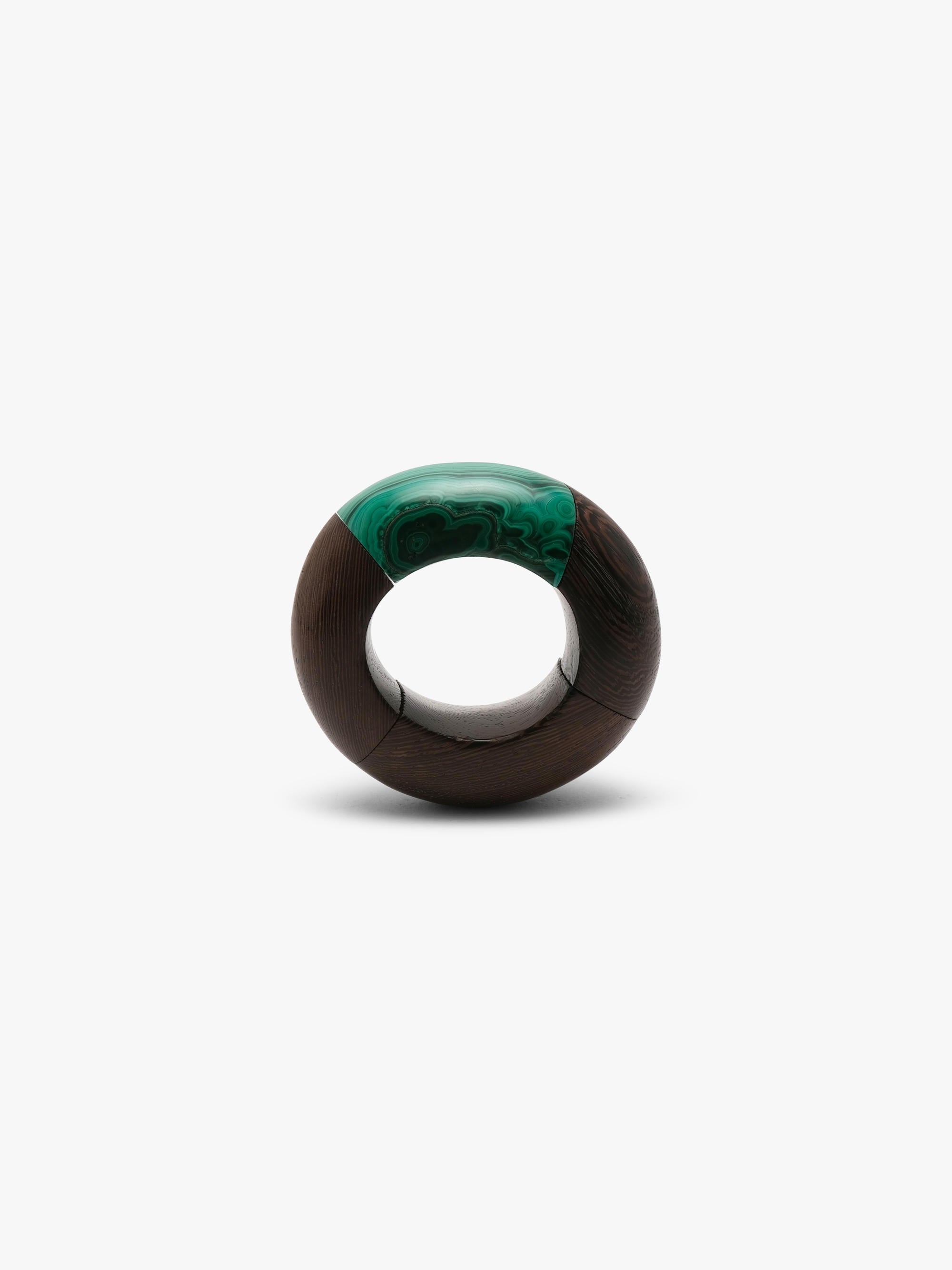 Brown and green bracelet on a white background