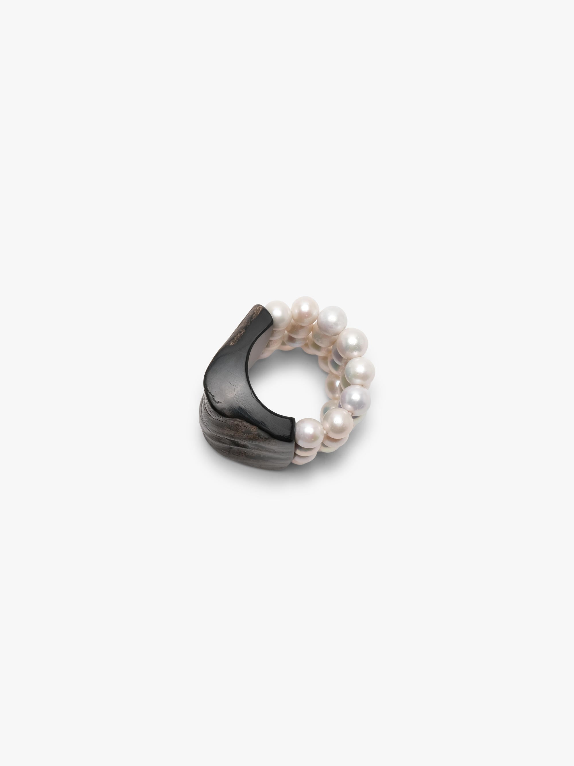 bracelet made of horn and freshwater pearls on a white background