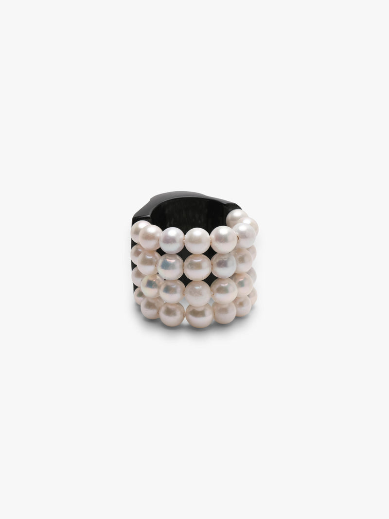 bracelet made of horn and freshwater pearls on a white background