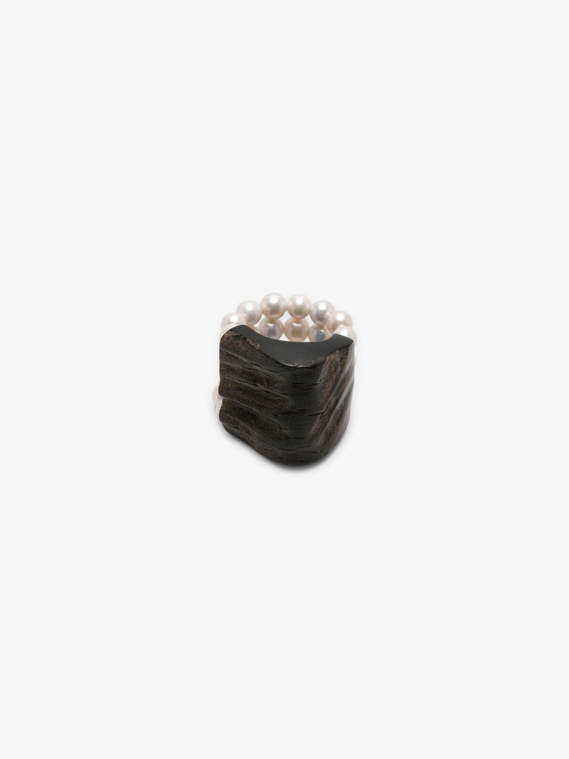 bracelet made of horn and freshwater pearls on a white background