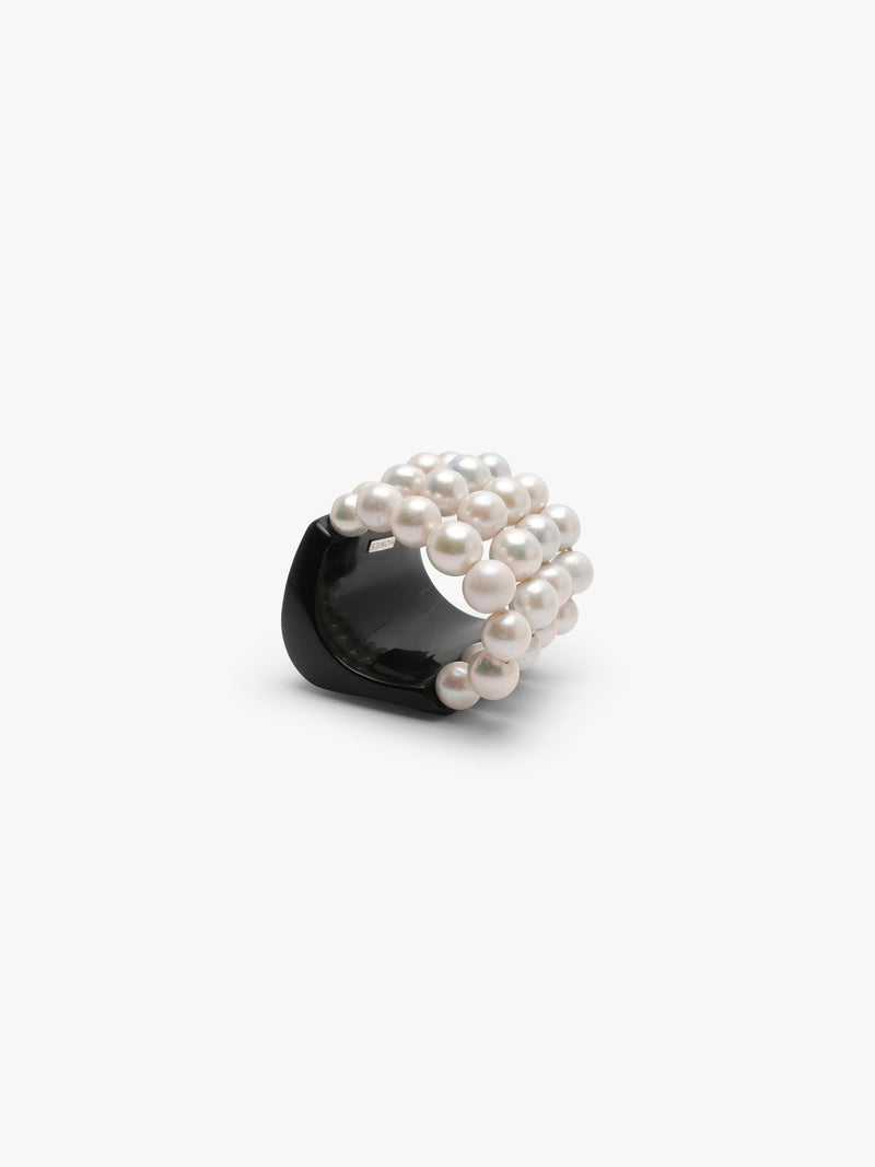 bracelet made of horn and freshwater pearls on a white background