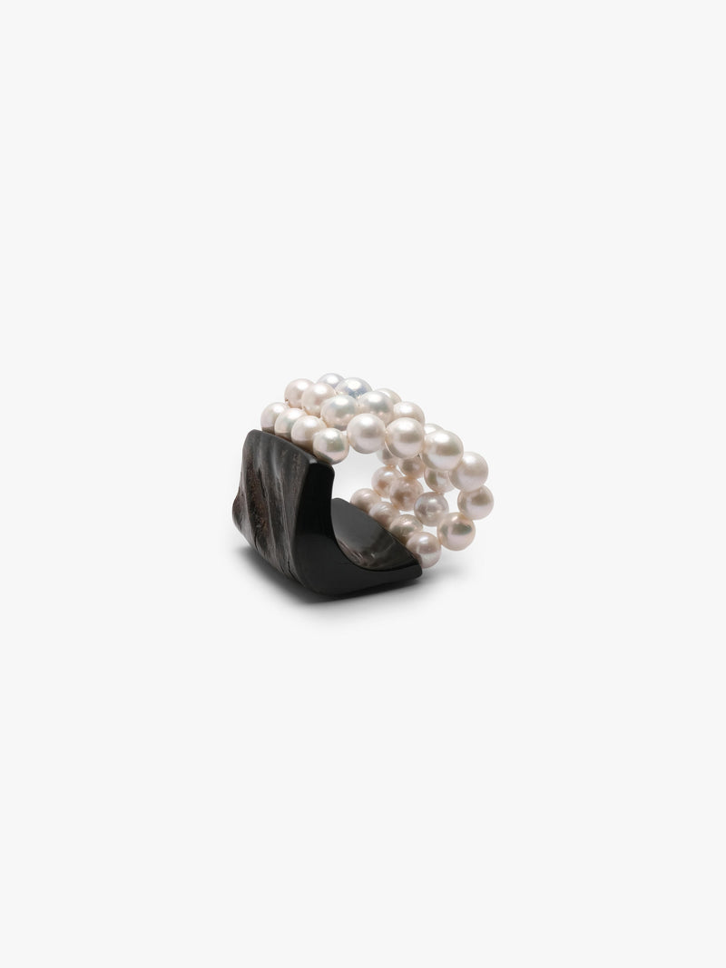 bracelet made of horn and freshwater pearls on a white background