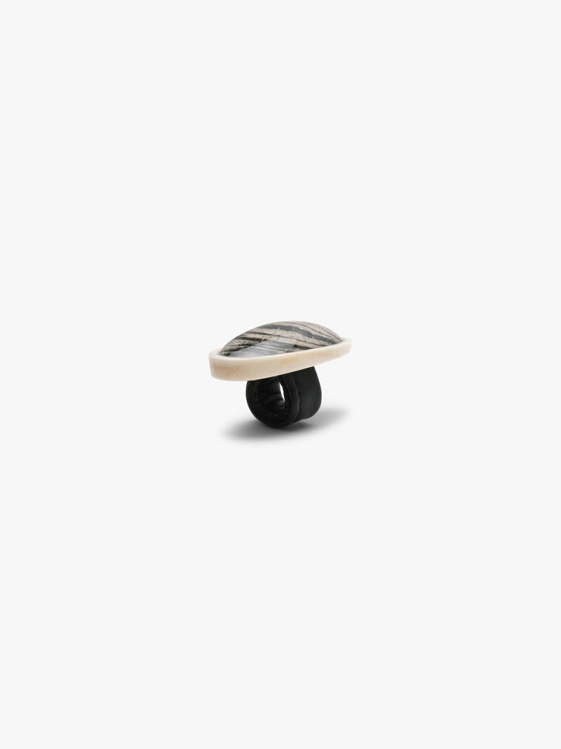 Small oval stone made of born, hornblende and quartz