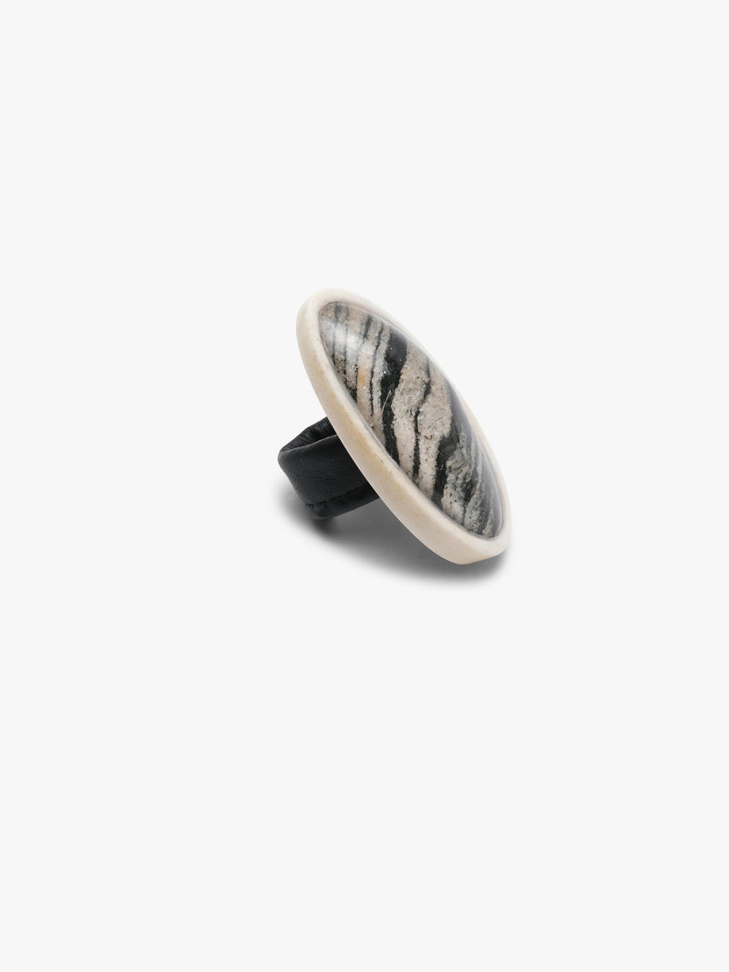 Small oval stone made of born, hornblende and quartz