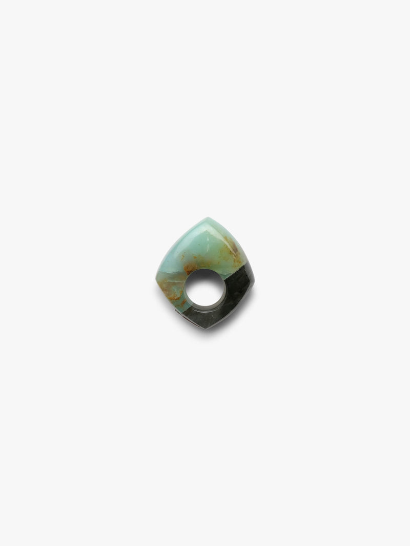 A single polished cabochon ring with a marbled pattern of light turquoise, olive green, and dark brown, shown on a plain light gray background.