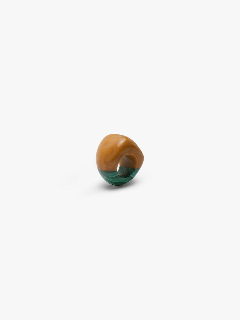 Ring made of two combined stones in a warm orange and green color, displayed on a white background