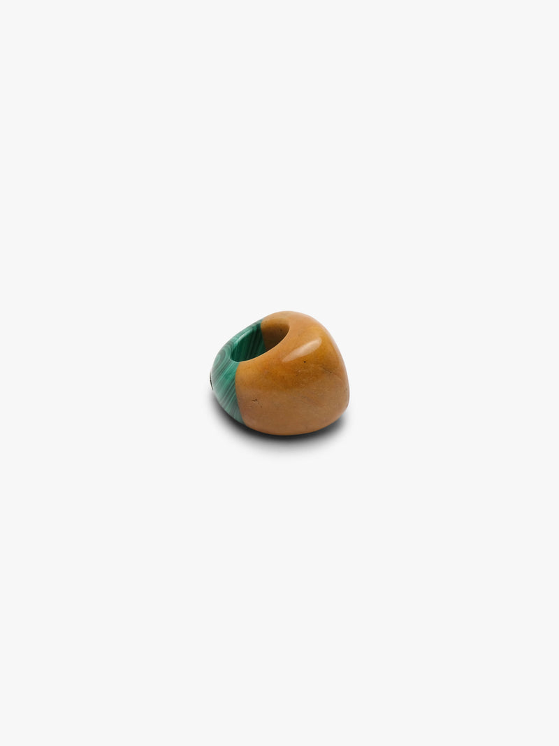 Ring made of two combined stones in a warm orange and green color, displayed on a white background