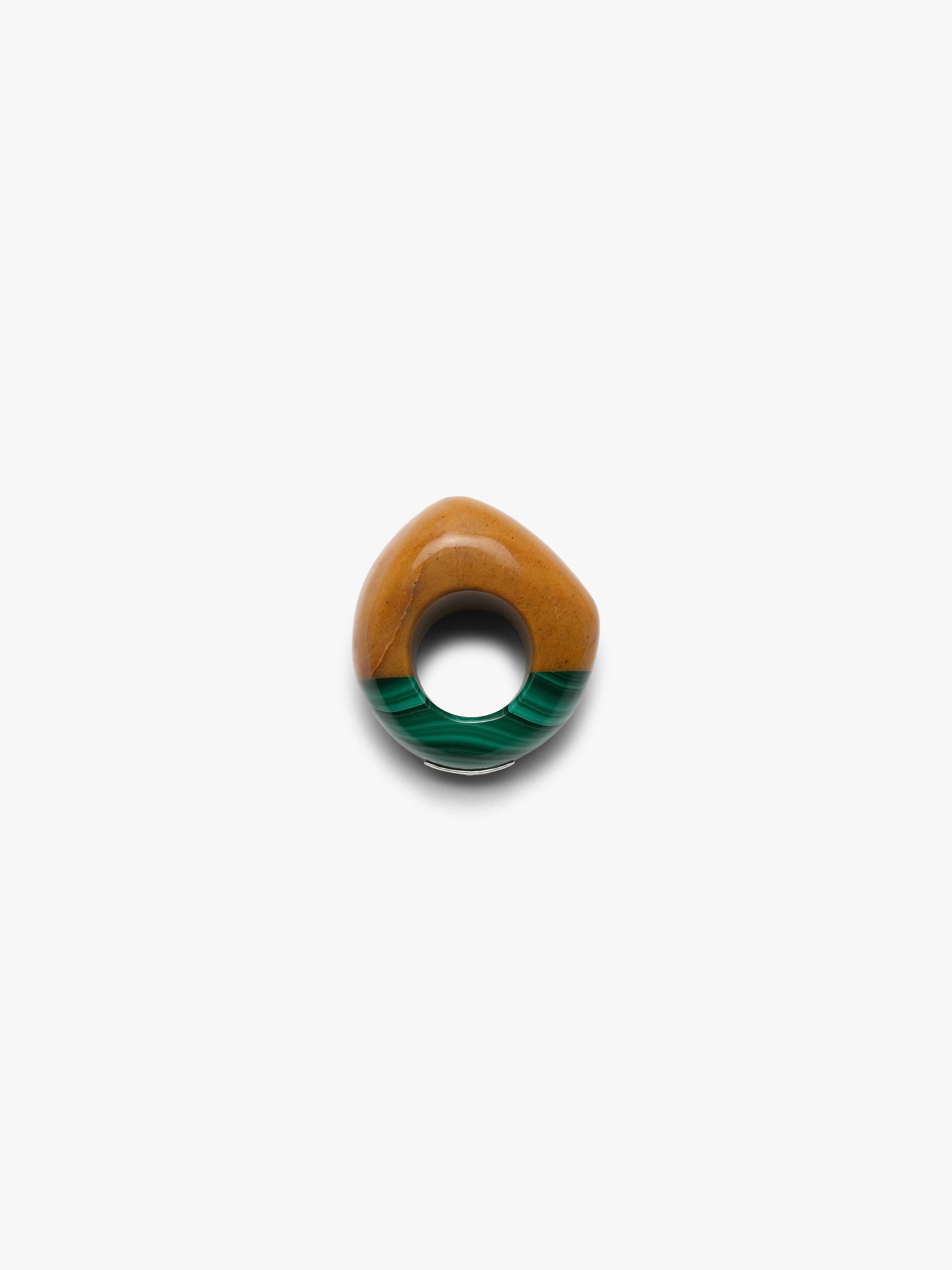 Ring made of two combined stones in a warm orange and green color, displayed on a white background