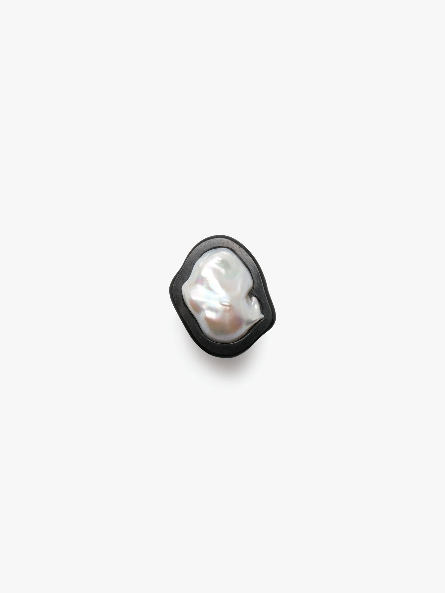 Ring: baroque pearl, ebony, leather