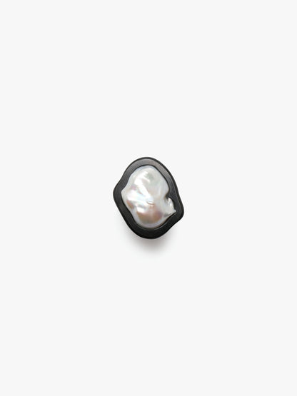 Ring: baroque pearl, ebony, leather