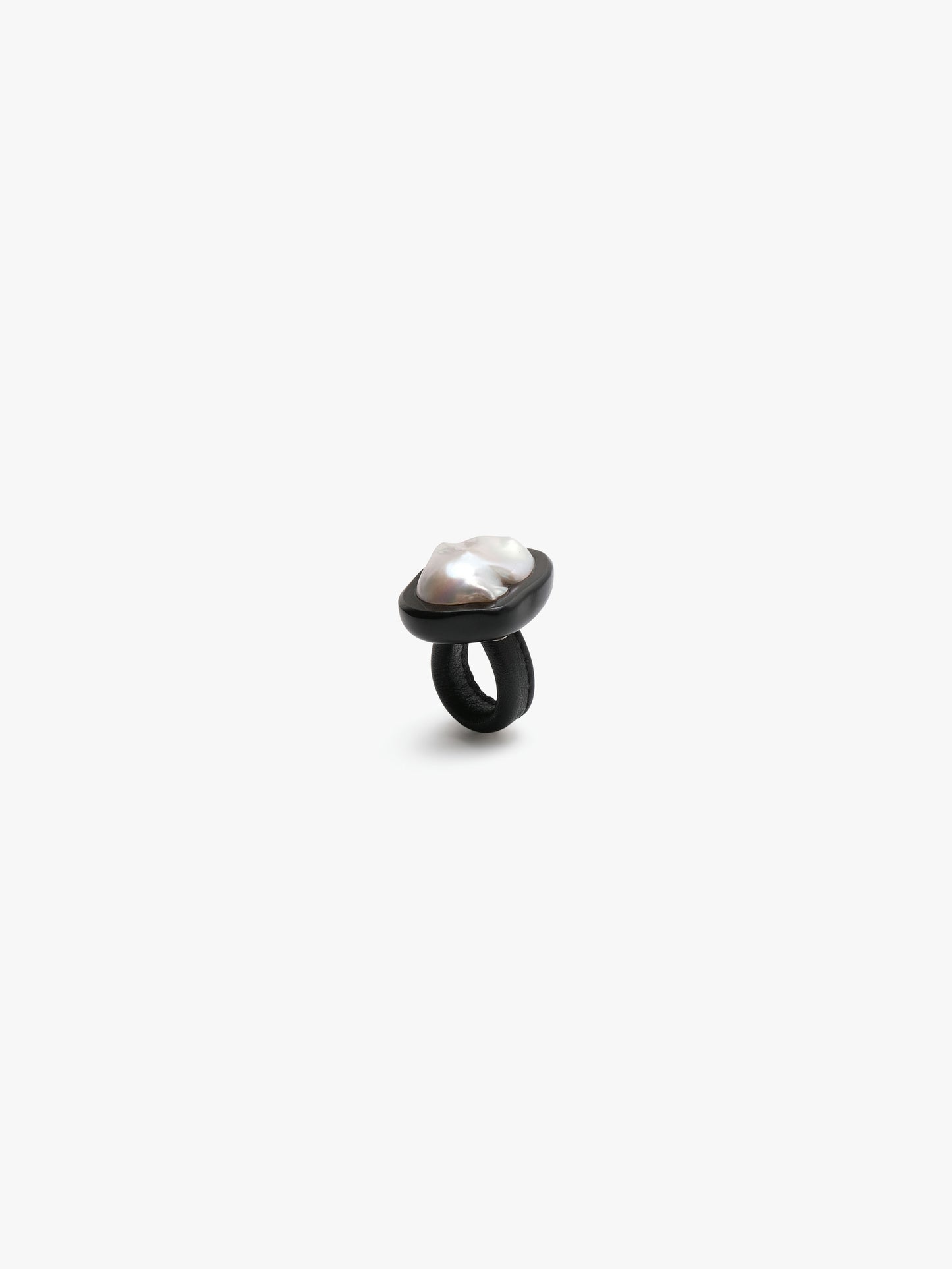 Ring: baroque pearl, ebony, leather