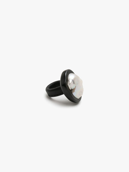 Ring: baroque pearl, ebony, leather