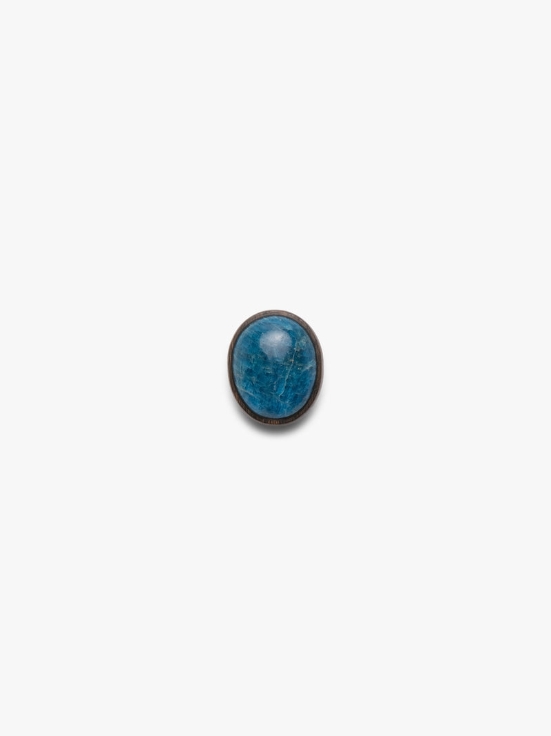 Blue oval stone ring on a white background