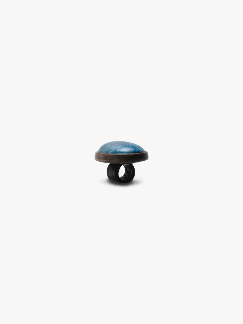 Blue oval stone ring on a white background