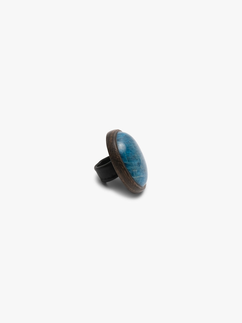 Blue oval stone ring on a white background