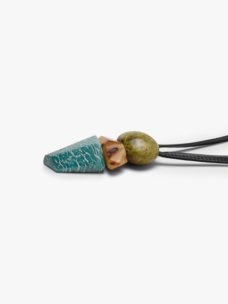 Leather cord pendant with a stone cluster of stones in greed, orange and blue with white stripes. Displayed on a white background