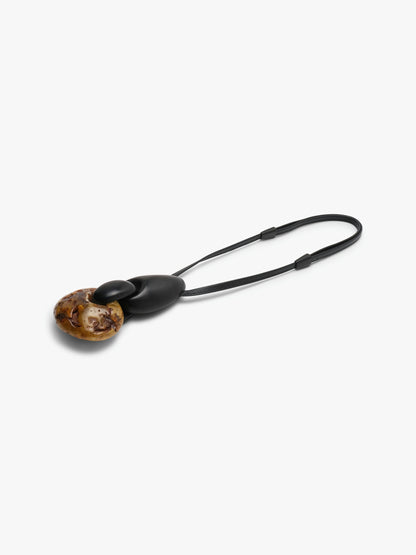 Pendant: amber, ebony, leather