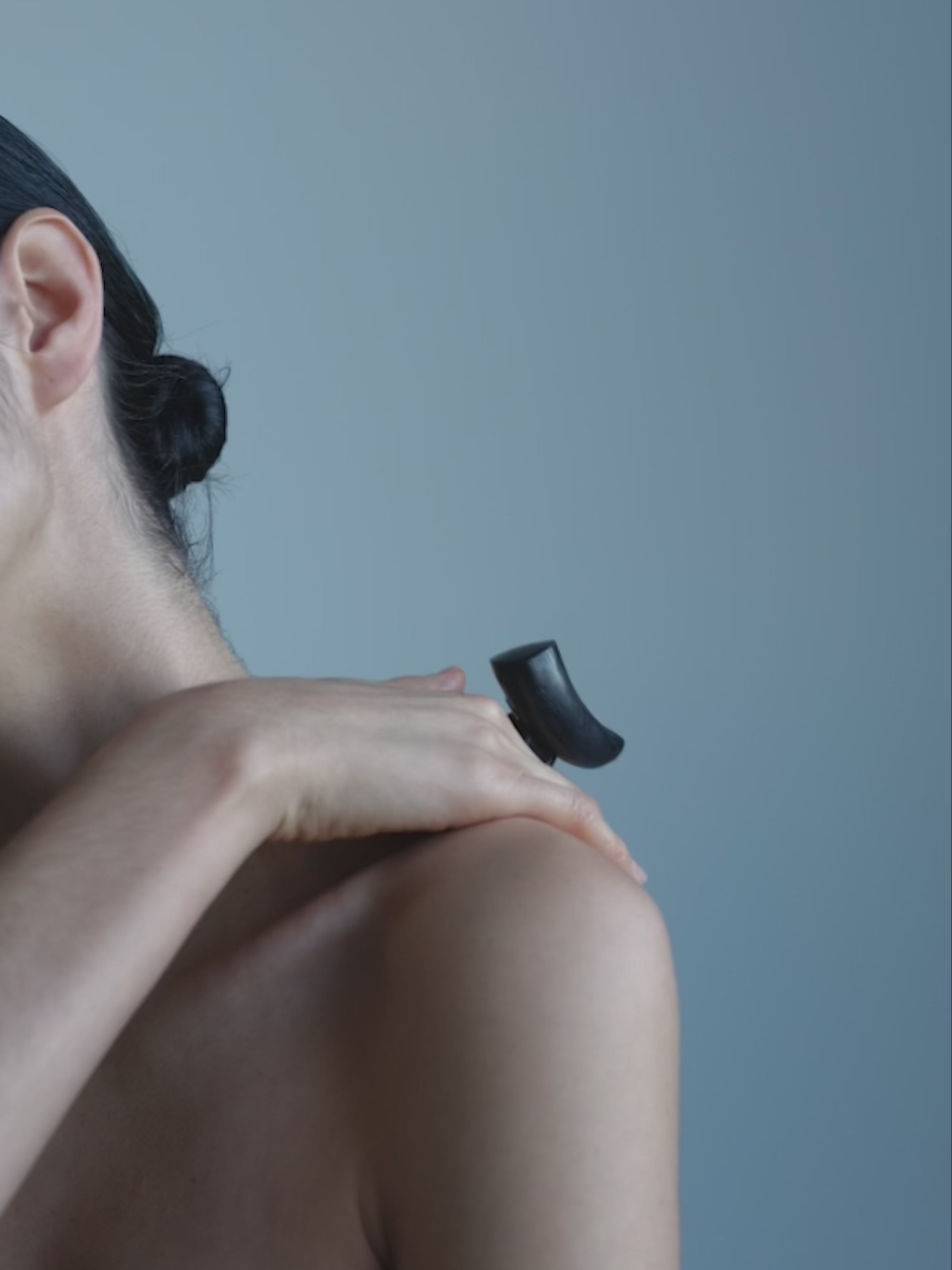 Woman wearing a black wooden ring