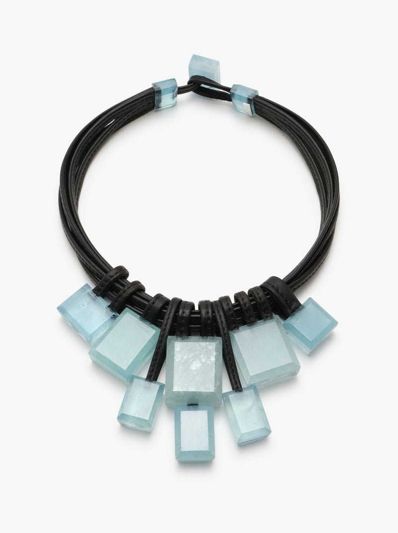 Aquamarine gemstone necklace with leather accents and a toggle clasp lock