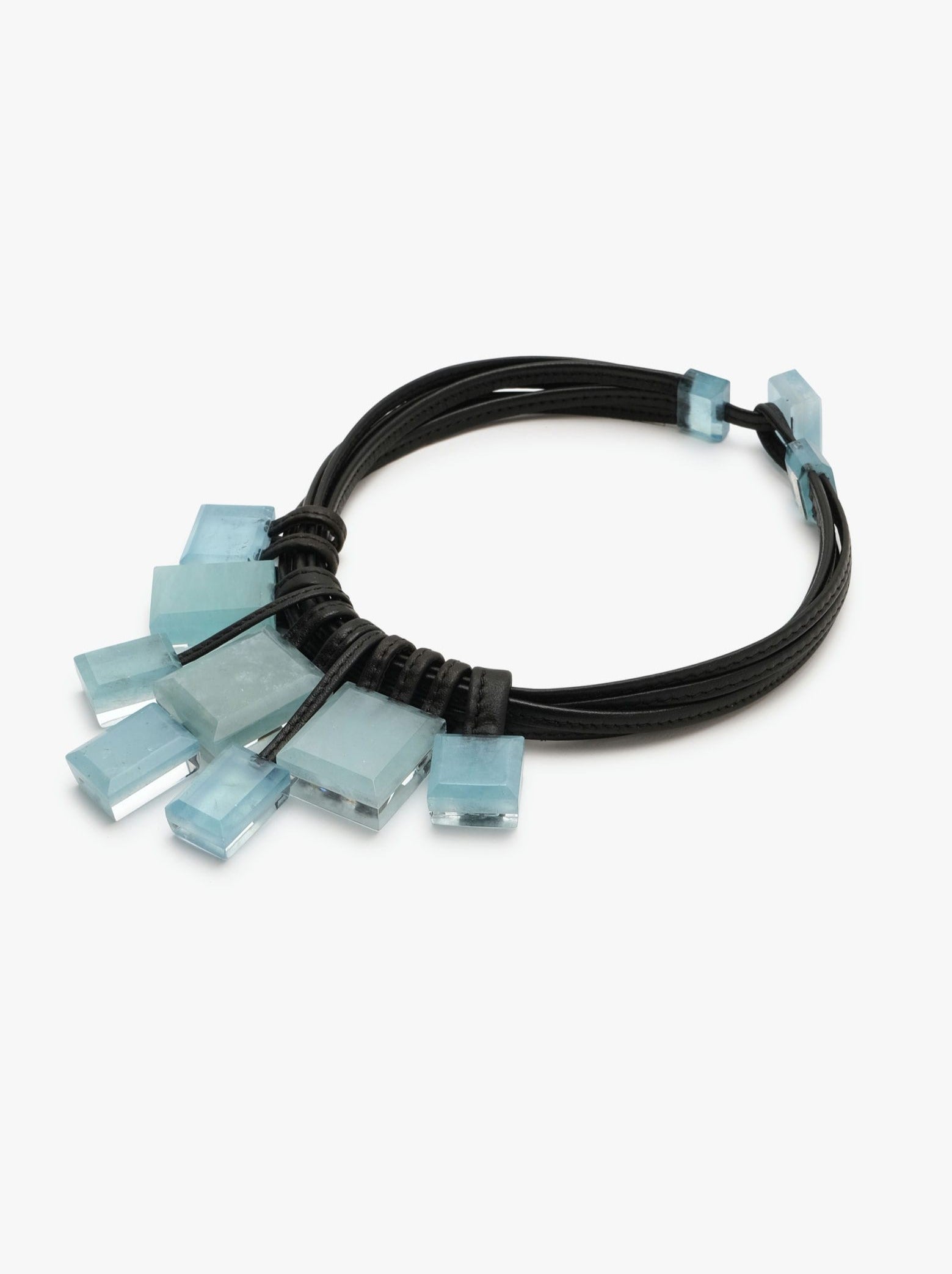 Aquamarine gemstone necklace with leather accents and a toggle clasp lock