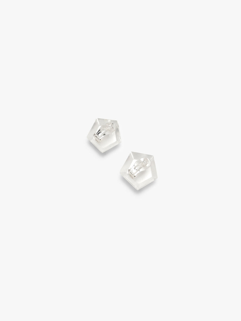 A pair of small, clear, pentagonal stud earrings on a solid white background.