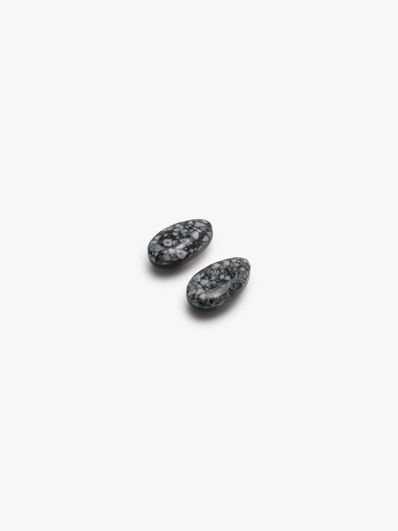 grey stone earring with grey, white and black accents on a white background