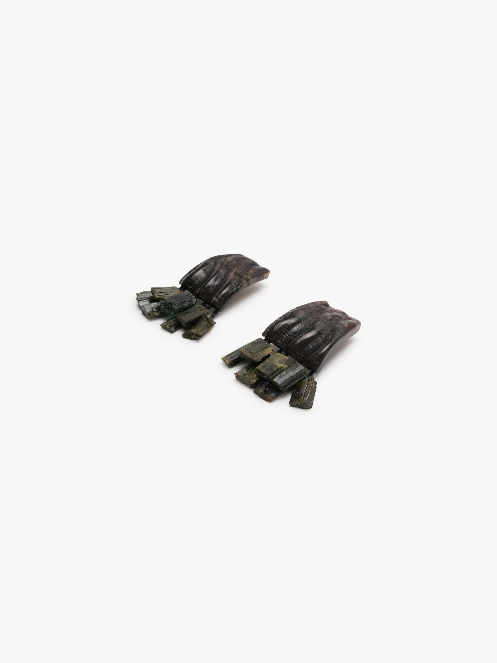 brown and green earrings on a white background