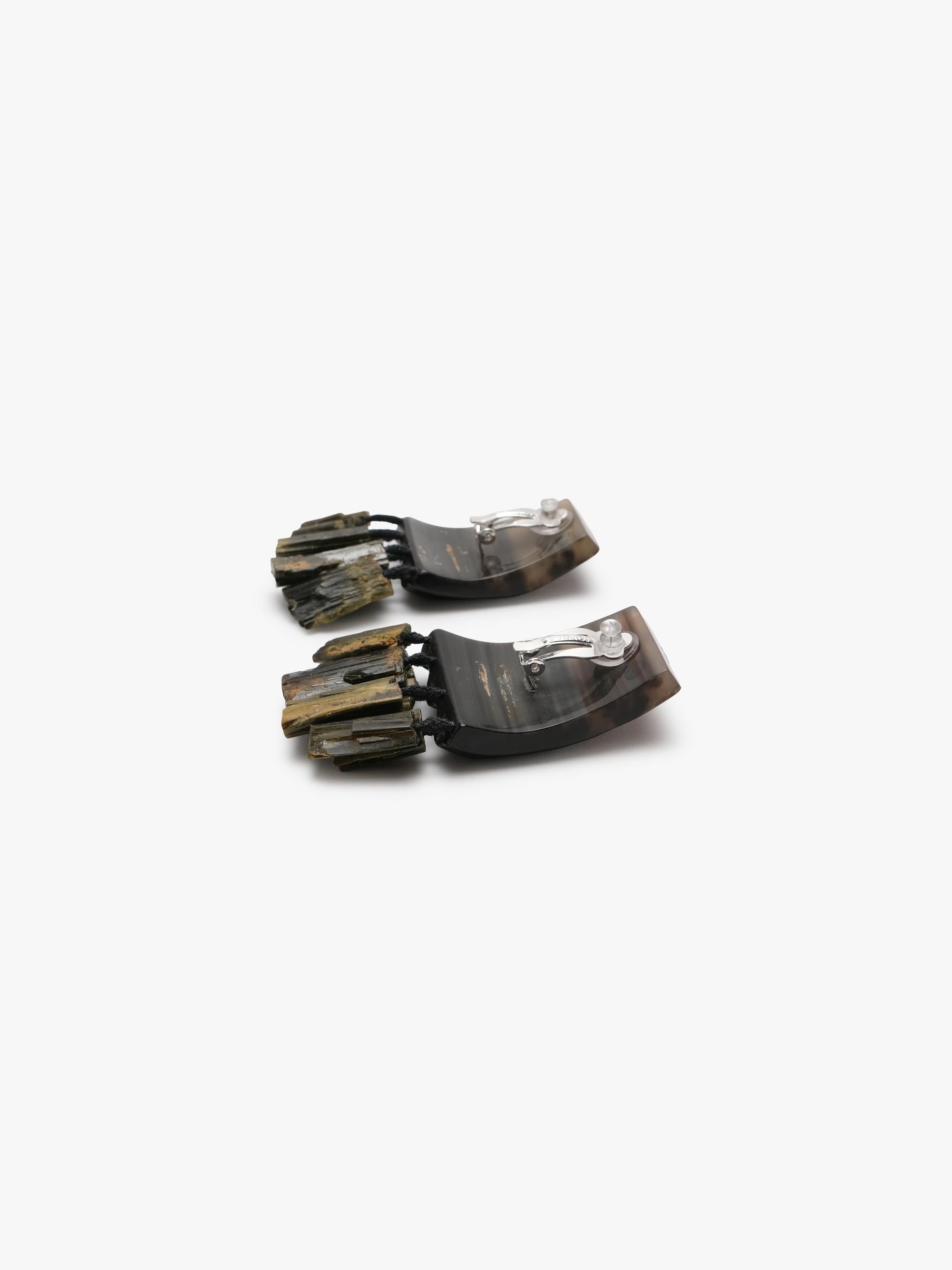 brown and green earrings on a white background