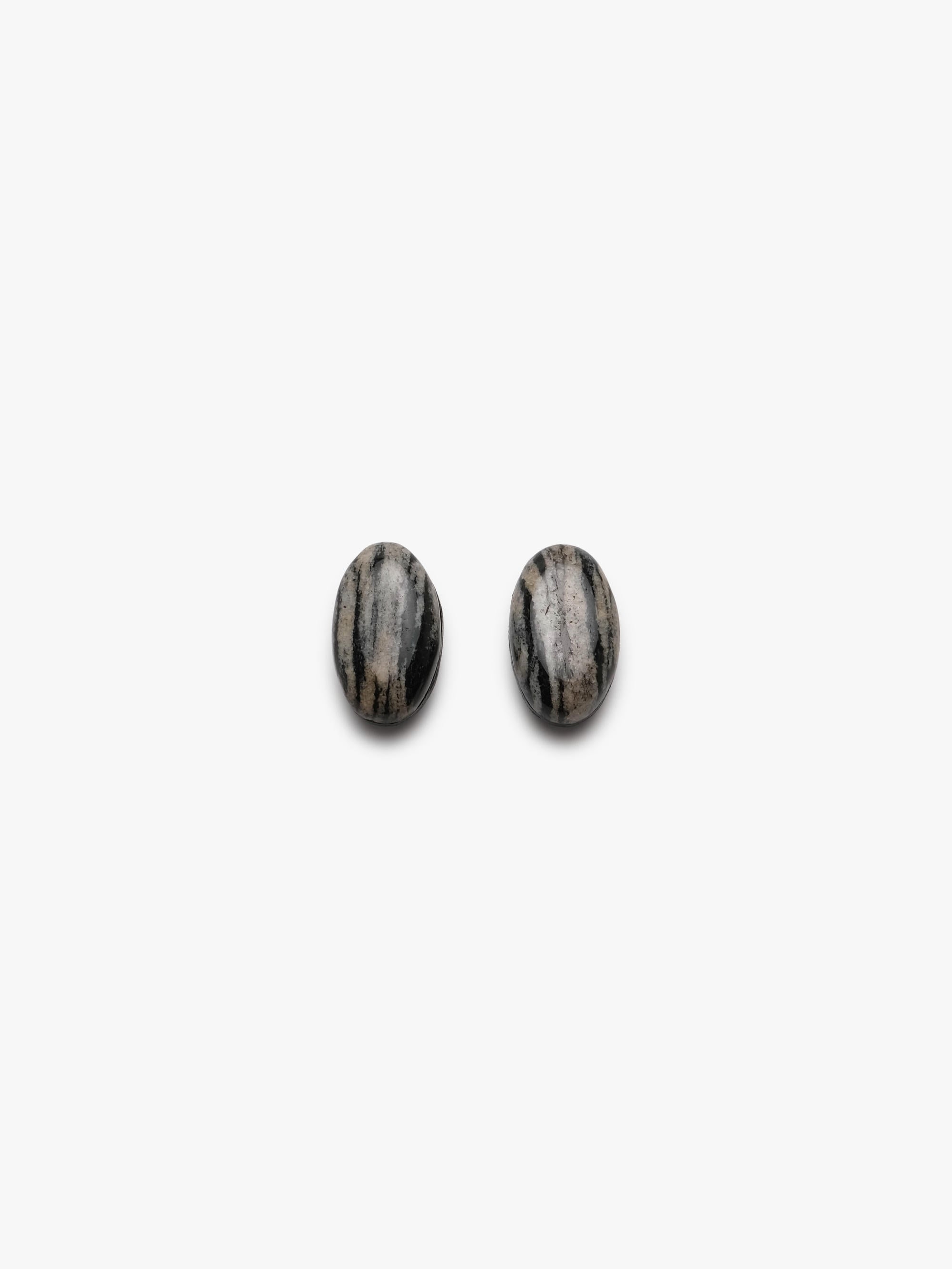 two striped earrings in natural stone on a white background