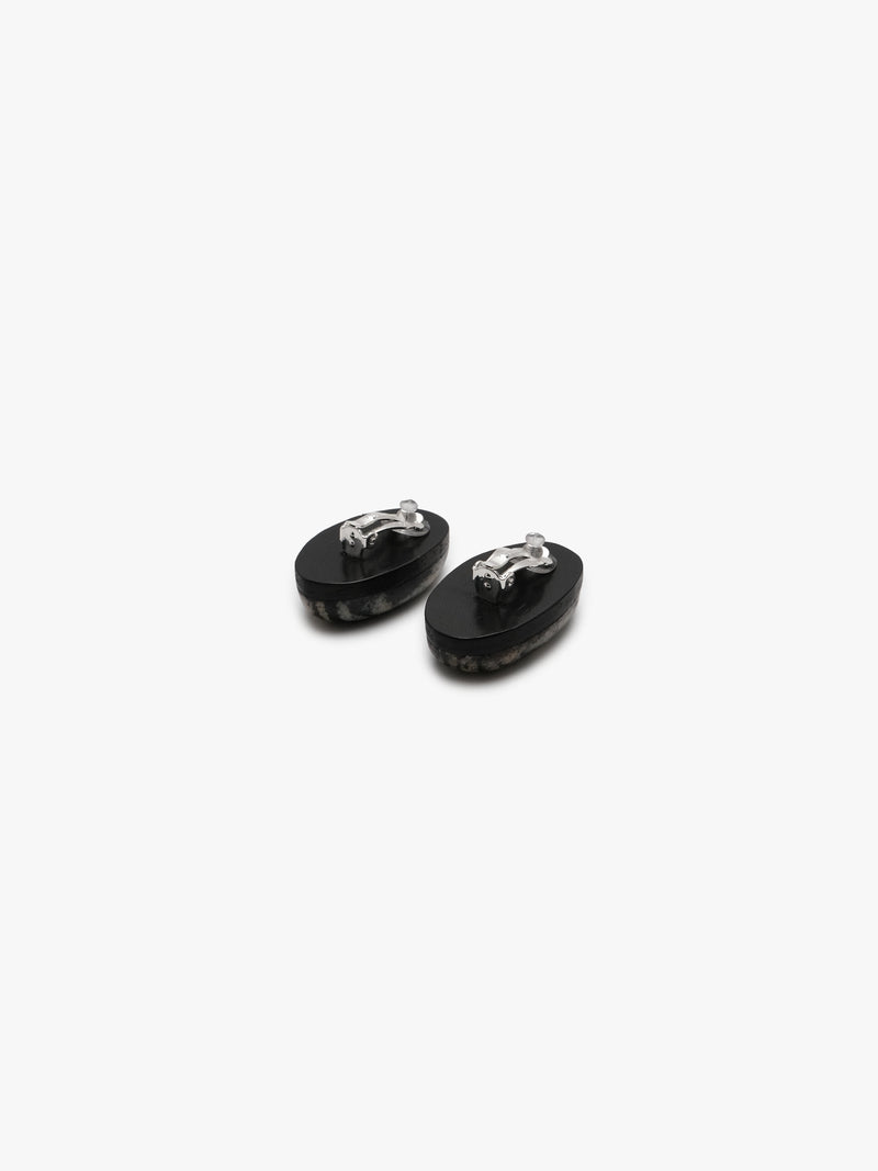 two striped earrings in natural stone on a white background