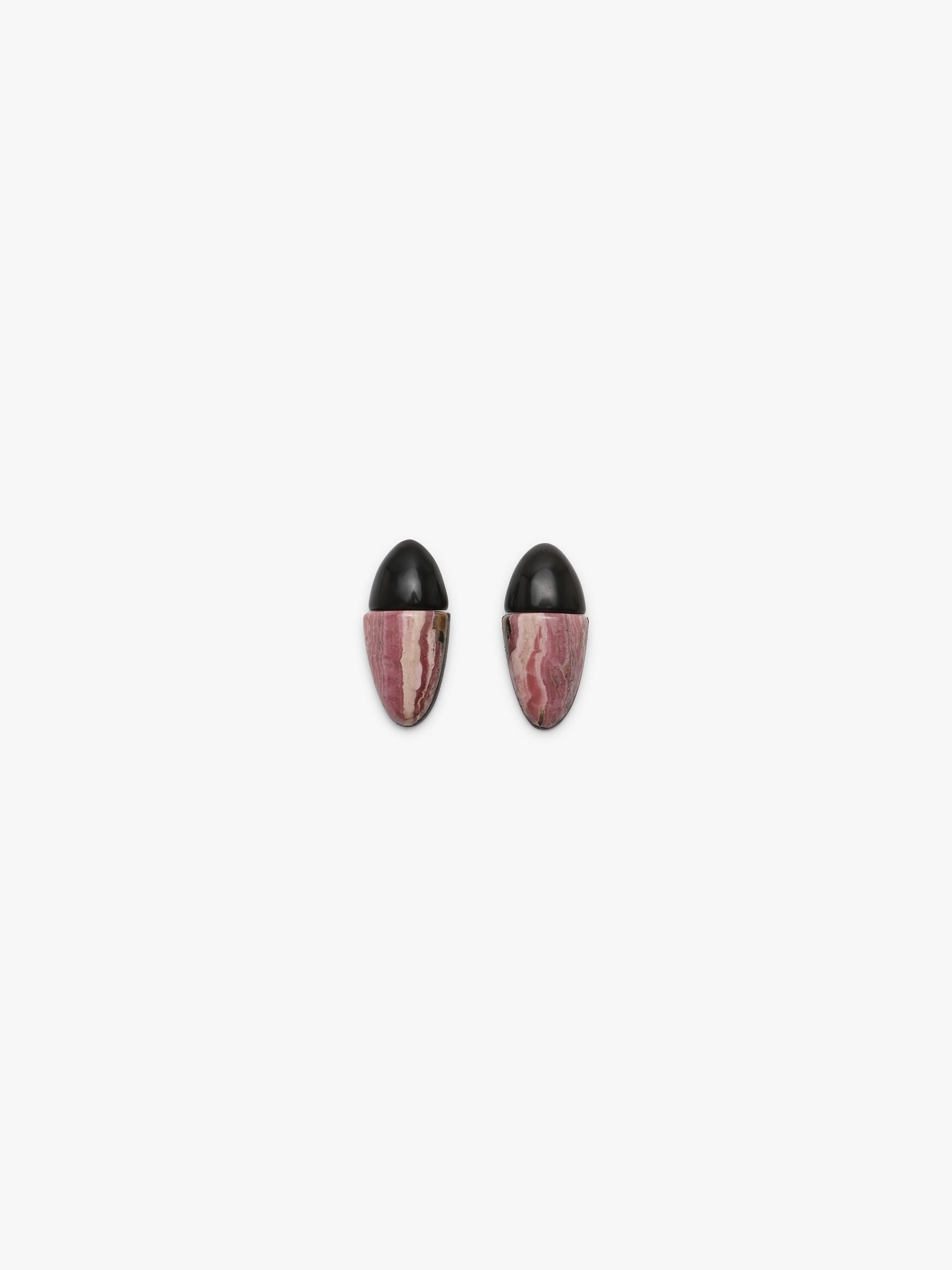 A pair of earrings with black oval tops and marbled pink and white stone lower halves, shown on a plain light gray background.