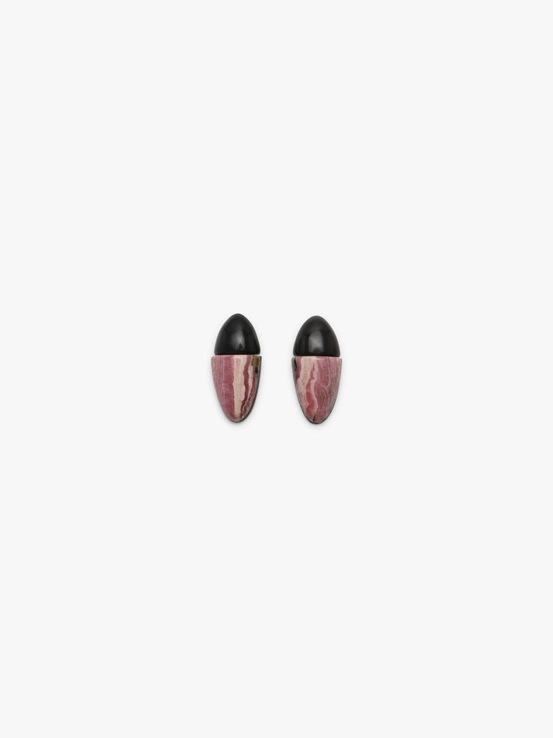 A pair of earrings with black oval tops and marbled pink and white stone lower halves, shown on a plain light gray background.