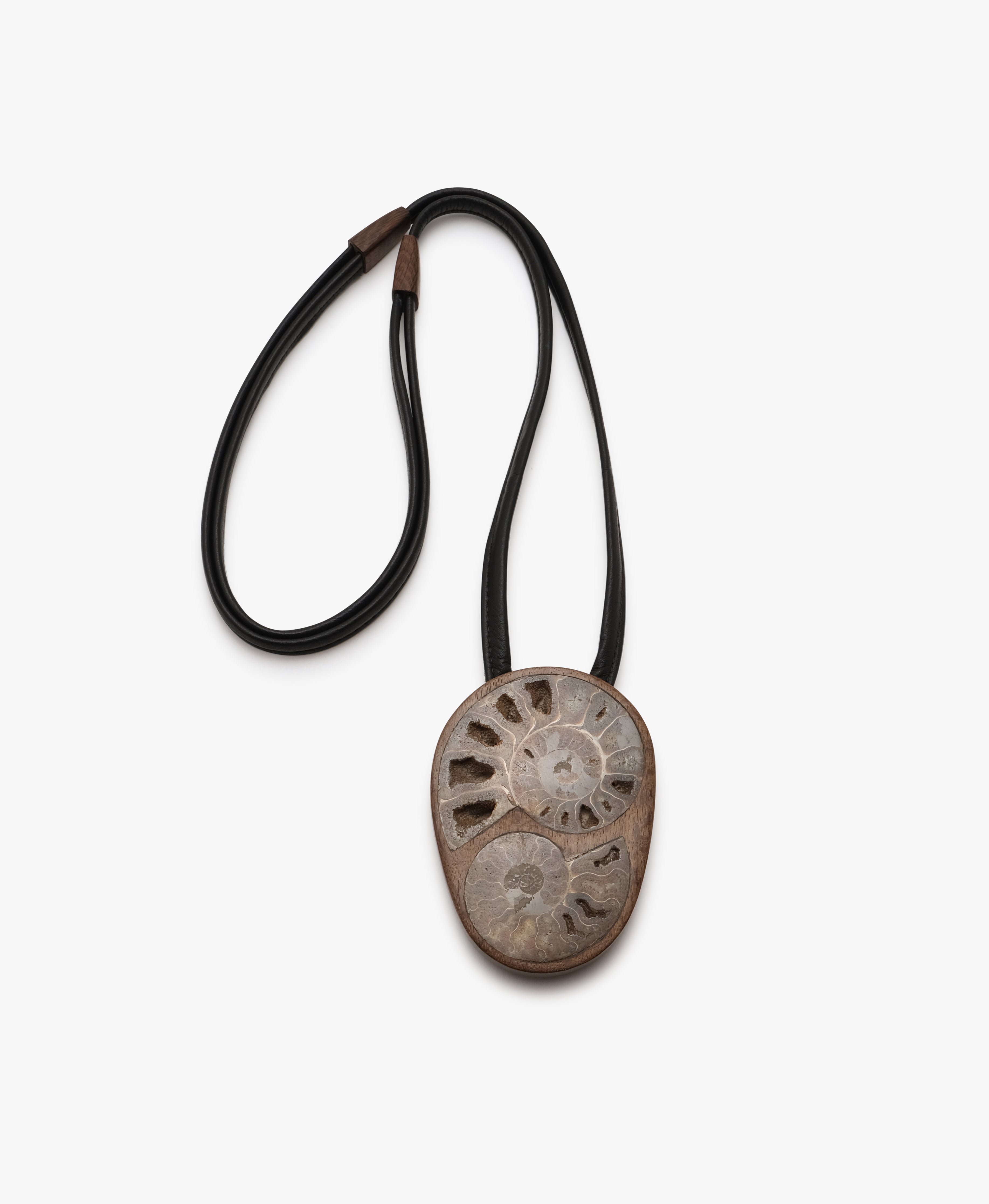 Pendant: bog oak, ammonite, leather