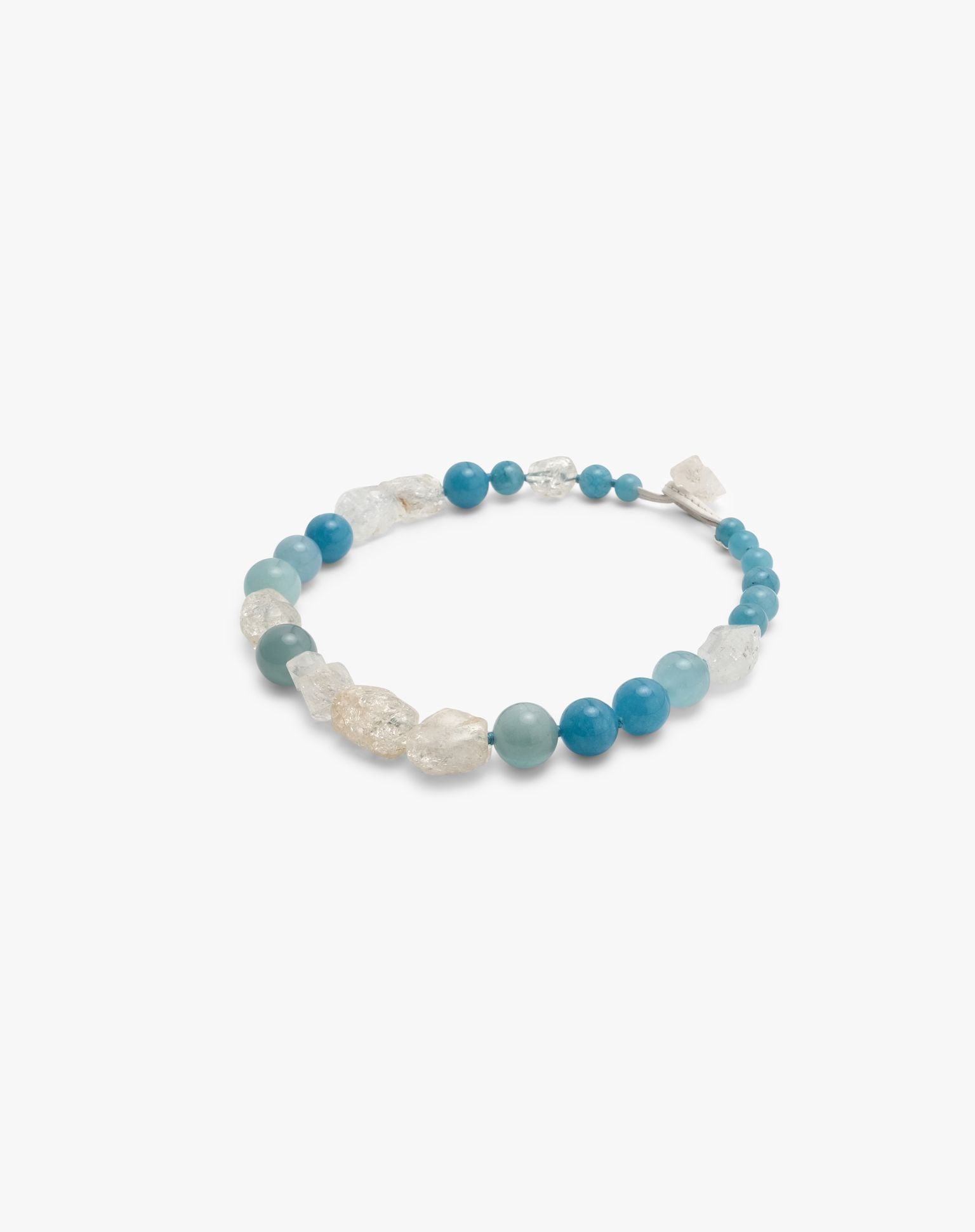 necklace made of blue and clear crystal beads displayed on a hite background