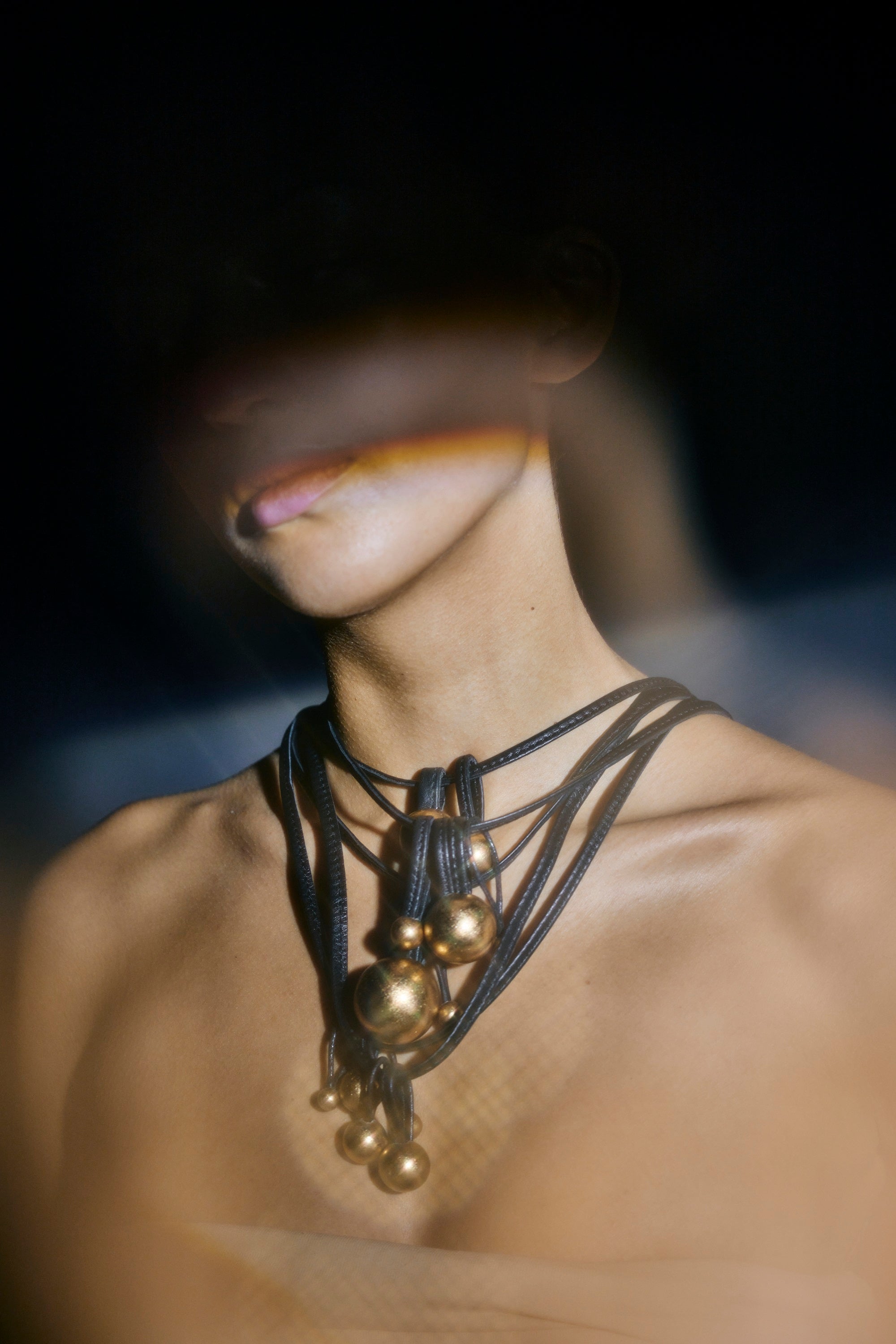 Domu necklace: leather, goldfoil