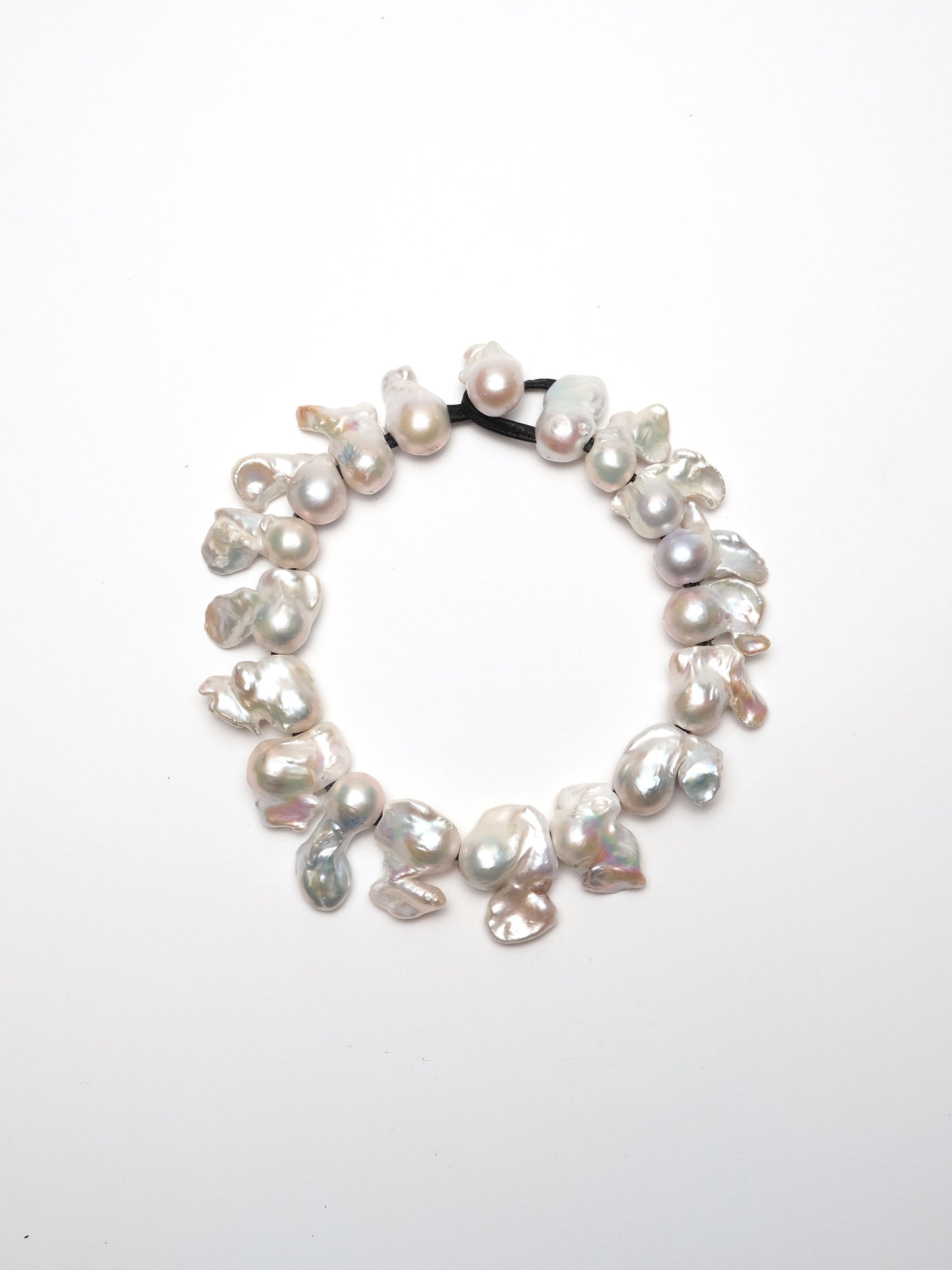 Necklace: baroque pearls, leather