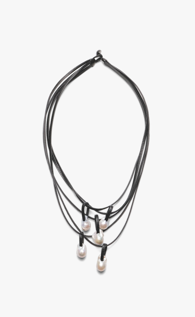 A black leather necklace with baroque pearl accents and a toggle clasp lock.
